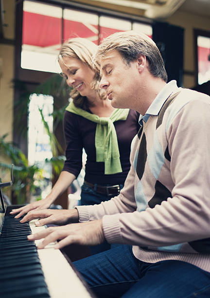 istock couple playing the piano 173990191