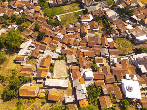 istock Contrasts between a densely populated village and trees 1739962412