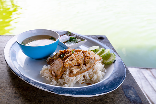 roasted pork with rice at river side