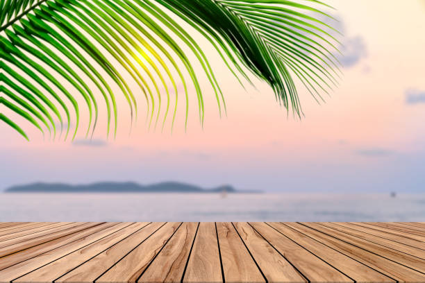 istock Wooden table with beach landscape blur background 1739984915