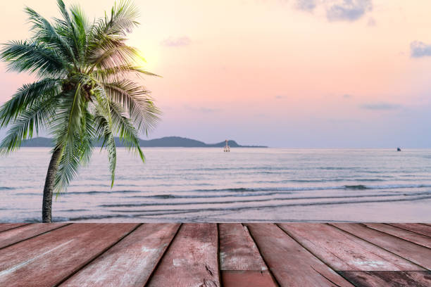 Wooden table with beach landscape blur background