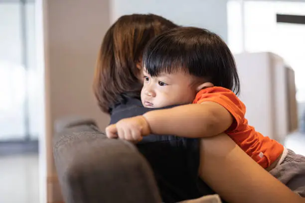 Sad Son Hugging His Mother, background for the ad and wallpaper in the children and family scene. Actual images in decorating ideas
