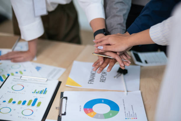 istock Business people teamwork stack touch arms palms together celebrating promotion reward, succeed common aim. give high five symbol of unity 1740011009