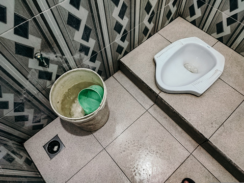 Public toilet with squat model, Indonesian squat toilet, Asian toilet model, sitting toilet