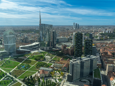 Milano, Italy. Amazing aerial landscape of the iconic Unicredit tower, UnipolSai tower, the Bosco Verticale and BAM public park. Super view of the Porta Nuova district