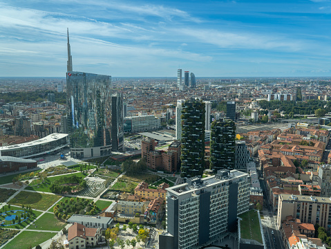 Milano, Italy. Amazing aerial landscape of the iconic Unicredit tower, the Bosco Verticale and BAM public park. Super view of the Porta Nuova district