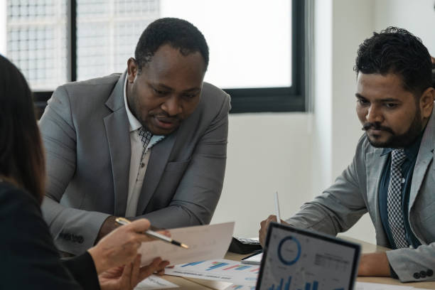istock Diverse team different and data with sales strategy at office. Talk, collaboration and teamwork with brainstorming and paperwork analysis of finance with statistics 1740072911