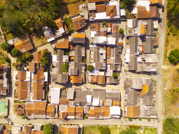 istock Contrasts between a densely populated village and trees 1740093780