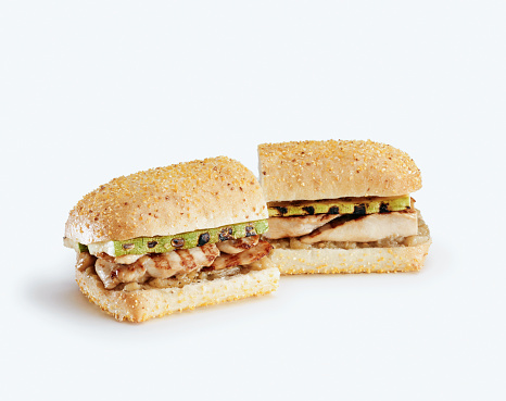 Sandwich with chicken and cheddar cheese on a white background