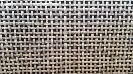 Close up of texture pattern of rattan netting material used for furniture decoration and upcycling