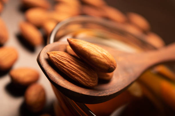 istock Closeup of almonds in spoon 1740100240