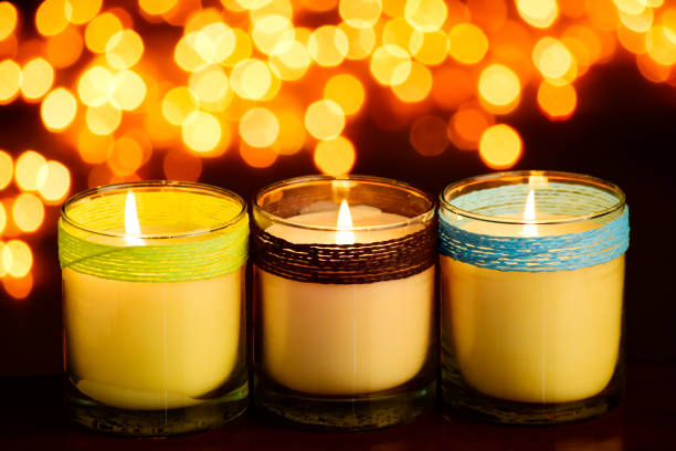 istock Set of beautiful candle jars at table with light bokeh background 1740100336