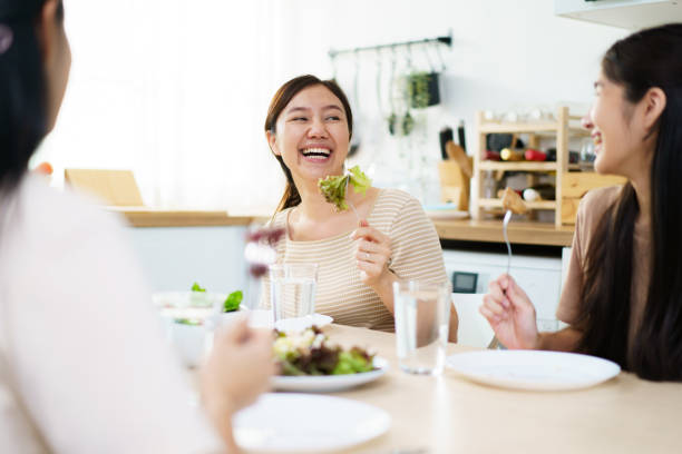 istock Happy Asian people having a meal together. 1740102537