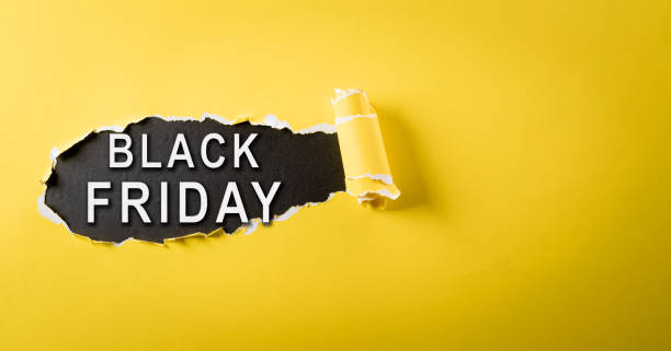 istock Top view of yellow torn paper and the text on blackboard background. Black Friday composition. 1740106400