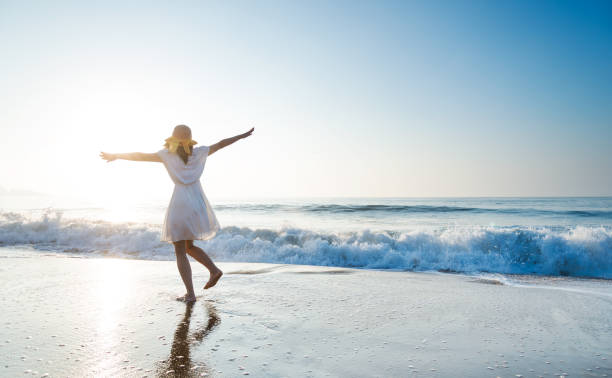 istock Young woman having fun at seaside 1740120691