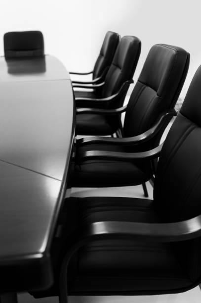 istock Black and white of empty meeting room 1740121236
