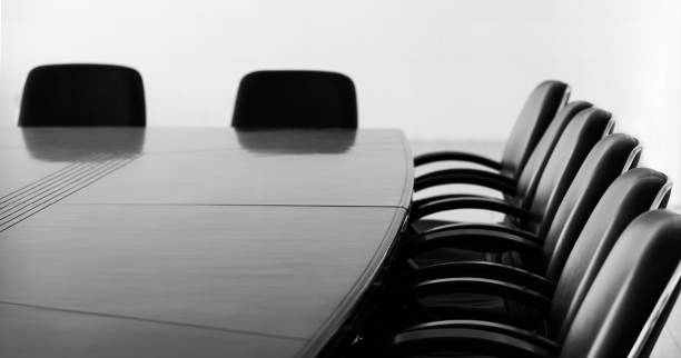 istock Conference table and chairs in empty meeting room 1740121761