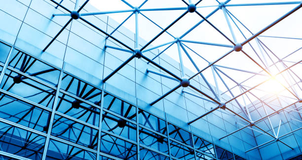 istock Low angle view of modern glass office building interior 1740122801