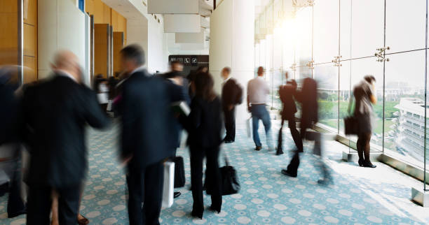 istock Business people talking and rushing in the lobby 1740124944