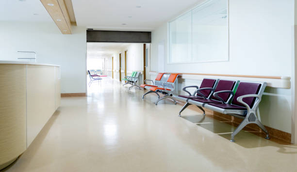 istock Empty nurses station and corridor in a hospital 1740126026