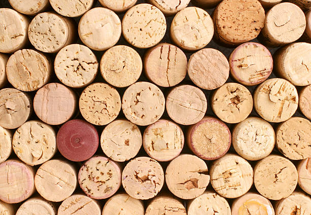 Collection of corks with one red one that doesn't match stock photo