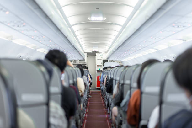 istock A compact aisle and snug seating within the budget airline cabin, entirely occupied by passengers of Asian descent, prepared for departure. 1740197117