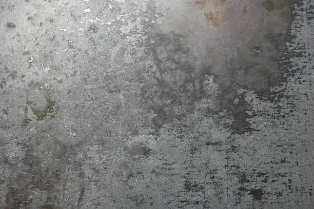 Sheet metal surface worn from wear and tear.