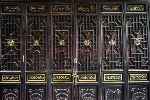 Traditional Chinese style wooden door of ancient temple in Chengdu, China.