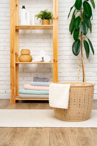 istock Beige plastic basket for laundry in a room 1740222782