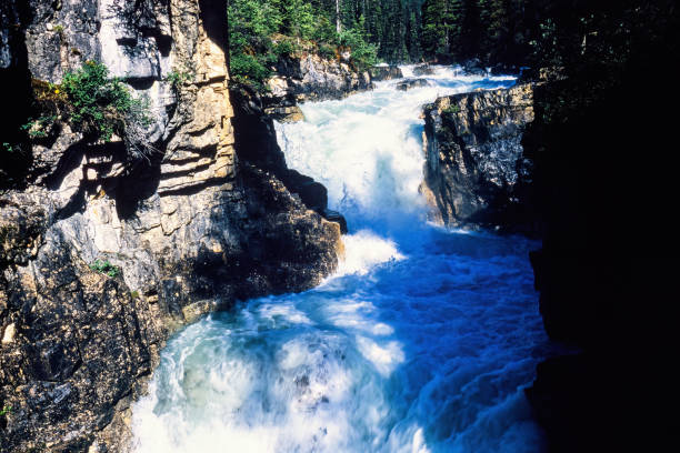 istock Waterfall in a canyon with a flowing water 1740245396