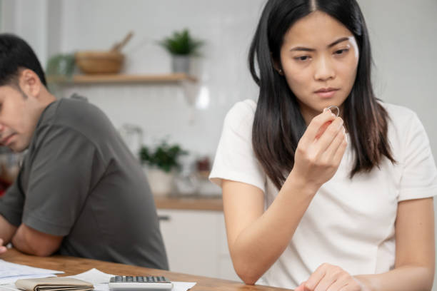 istock Quarrel, Divorce. husband and wife remove married ring. Couples desperate and disappoint after marriage. Divorce document, upset and frustrated after conflict. distrust, love problems, betrayals 1740245437