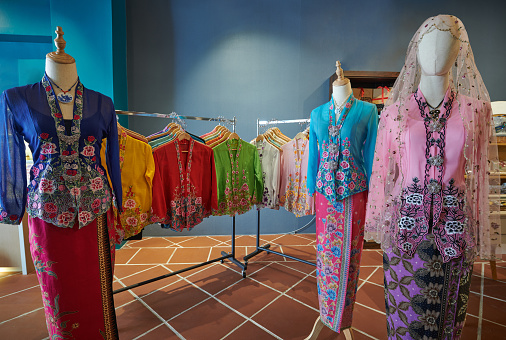 Colourful traditional Malay batik kebaya dress in display room
