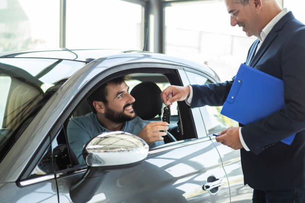 istock Happy Couple Cheers Their Car Acquisition 1740252526