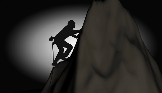Lonely and brave man climbing to the top in the dark. / You can see the animation movie of this image from my iStock video portfolio. Video number: 1735818092