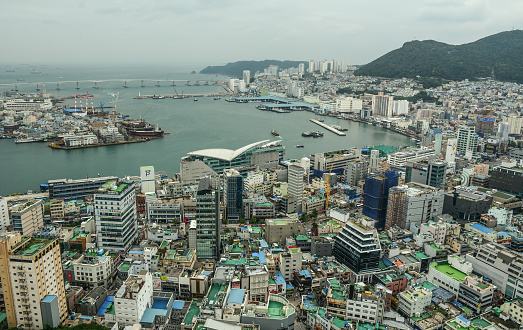 Busan, South Korea - Sep 18, 2016. Aerial view of downtown on coast in Busan, S. Korea. Beautiful scenery from Busan Tower in rainy day.