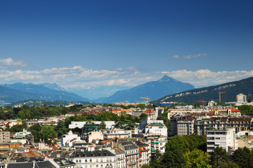 Aerial view to modern districts of the Eastern part of Geneva, with French Alps on background
