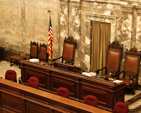 Front seats of the Washington State Senate or House of Representative chamber, reserved for the Speaker of the House/Senate President and clerks.  Location: Olympia, Washington.