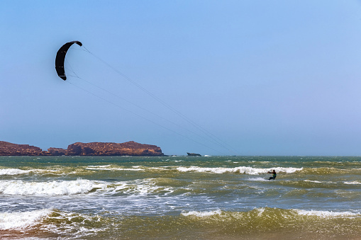 Kiteboarding activities on the Atlantic ocean waves in the Essaouira. Morocco