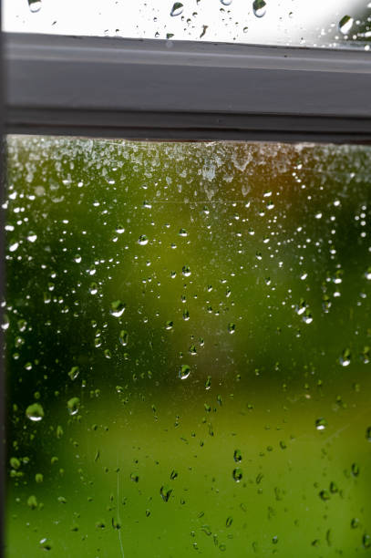 istock Close up of rain drops on window 1740318912