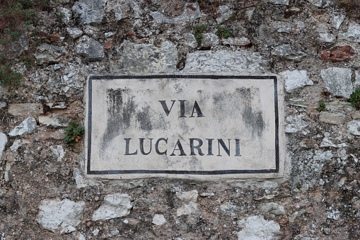 Old Italian street name sign on a building wall