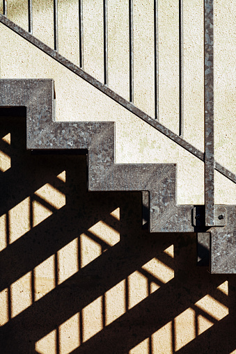 Metallic staircase and shadow as abstract background for architecture and geometry urban pattern