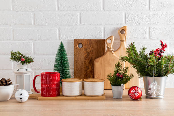istock Stylish Christmas decor in the Christmas kitchen. Beautiful kitchen utensils decorated with green spruce branches, balls, New Year's lantern. 1740368843