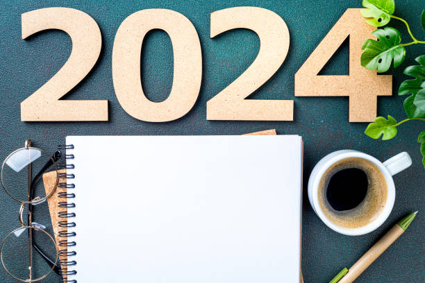 istock New year resolutions 2024 on desk. 2024 resolutions list with notebook, coffee cup on table. Goals, resolutions, plan, action, checklist concept. New Year 2024 template 1740382292