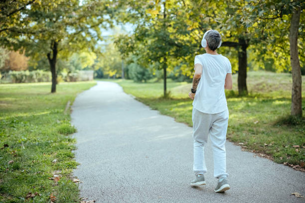 istock Female athlete running in the park. 1740403475