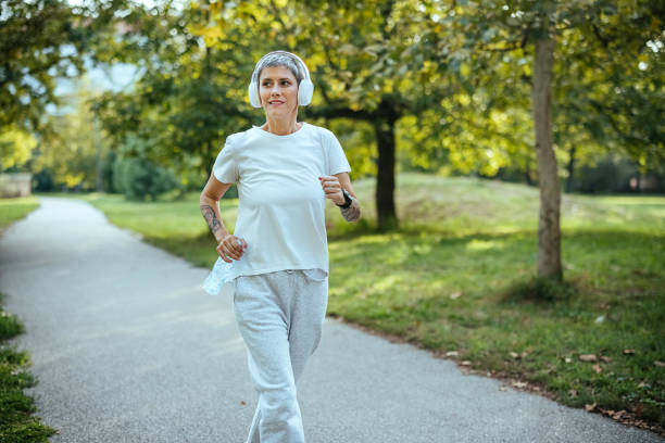 istock Female athlete running in the park. 1740403476