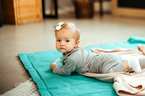 istock Baby girl learning to crawl 1740406802