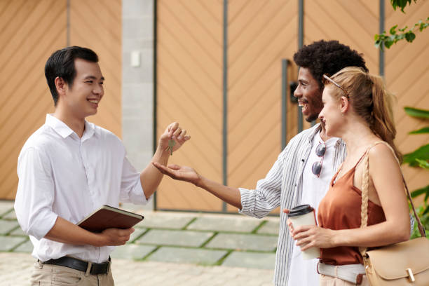 istock Estate Agent Giving Keys 1740408653
