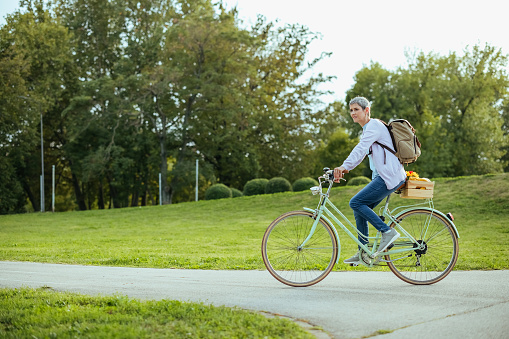 Woman rides a bicycle in the park