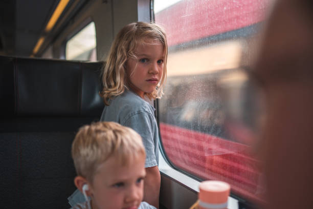 istock Caucasian Boy on a Train Observing the Scenery 1740425990