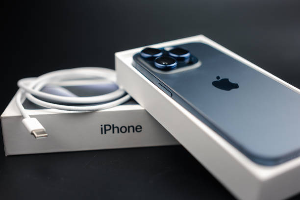 Bangkok, Thailand - October 17, 2023: iPhone 15 Pro Blue Titanium. A tech smartphone modern design and box with usb type-c cable. New cable standard for Apple's devices. Apple's gadgets.